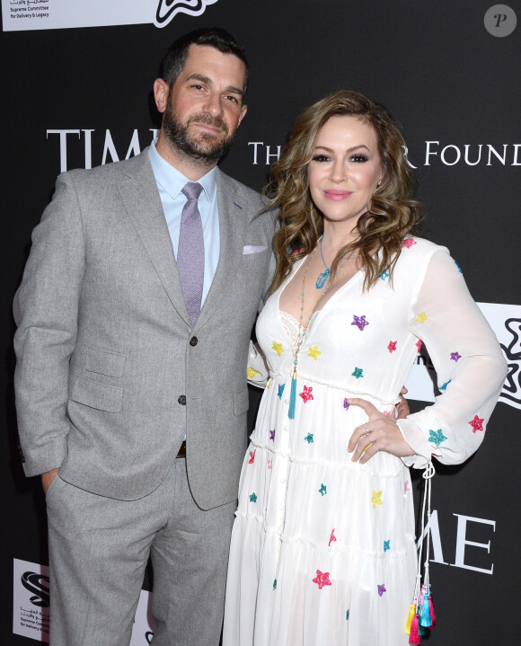 Alyssa Milano et son mari Dave Bugliari au photocall du 10ème anniversaire du gala caritatif "Core" à Los Angeles, le 15 janvier 2020. 