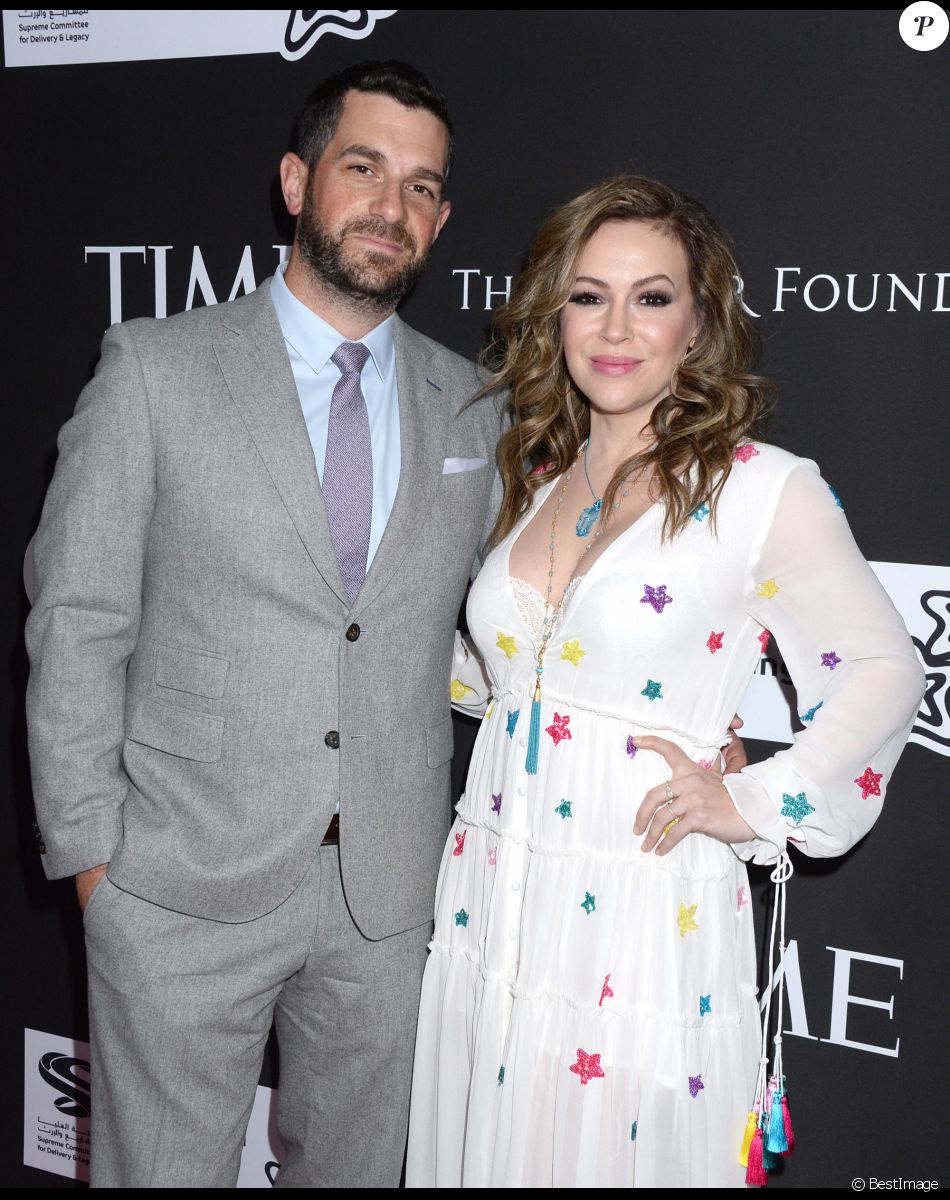 Alyssa Milano et son mari Dave Bugliari au photocall du 10ème anniversaire du gala caritatif "Core" à Los Angeles, le 15 janvier 2020.