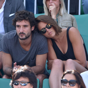 Laure Manaudou et Jérémy Frérot dans les tribunes lors de la finale des Internationaux de tennis de Roland-Garros à Paris, le 7 juin 2015.