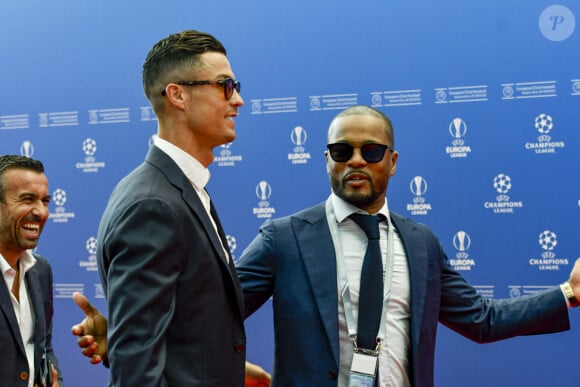 Cristiano Ronaldo, Patrice Evra au photocall de la cérémonie du tirage au sort de la phase de poules de l'édition 2019-2020 de la Ligue des Champions à Monaco, le 29 août 2019.