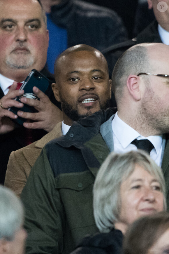 Patrice Evra dans les tribunes du stade Old Trafford lors du match de 8ème de finale aller de Ligue des champions opposant le Paris Saint-Germain à Manchester Unted à Manchester, Royaume Uni, le 12 février 2019. PSG a gagné 2-0.