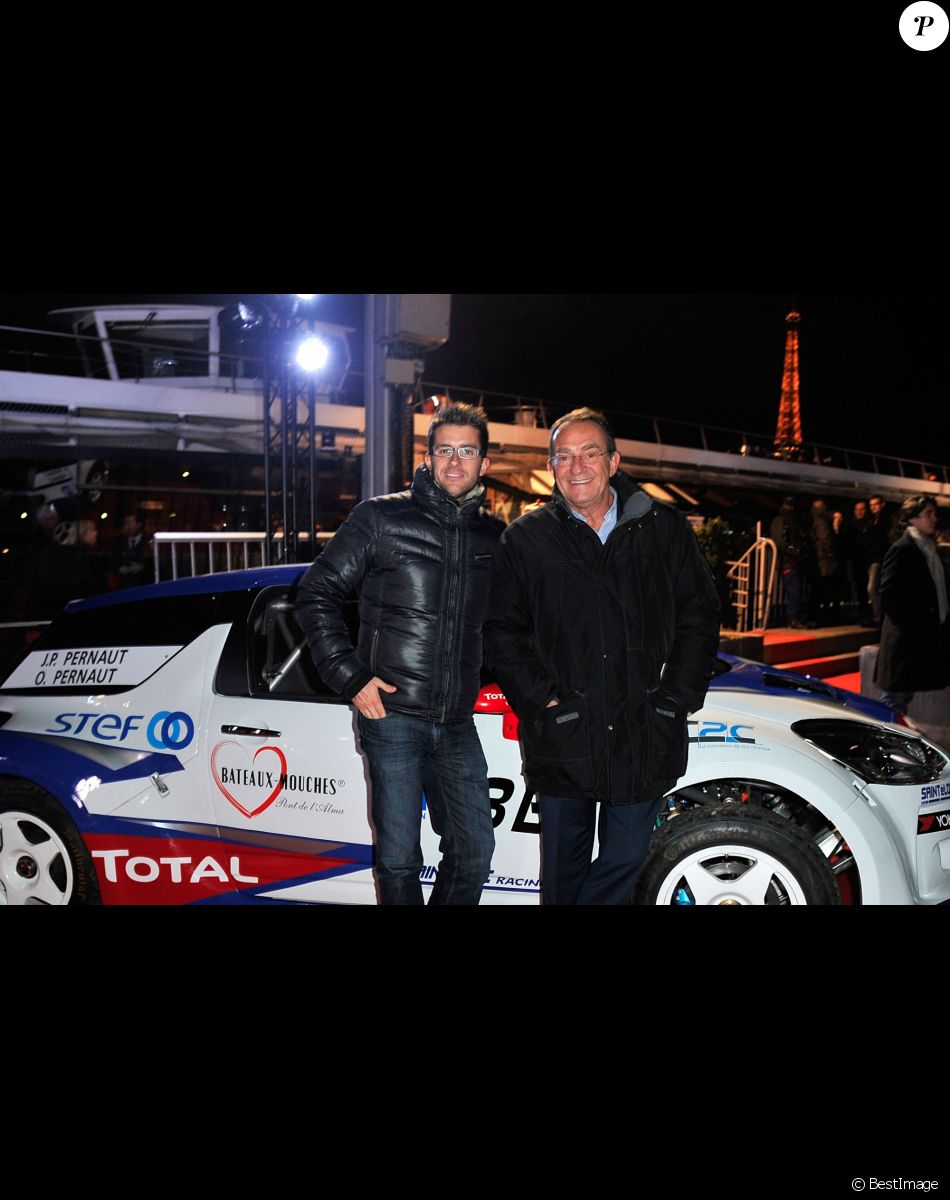 Jean-Pierre Pernaut et son fils Olivier posent devant leur Citroen C4 lors de la conference de presse de la 25eme edition du Trophee Andros a Paris le 27 novembre 2013.