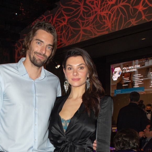 Exclusif - Le nageur Camille Lacourt et sa compagne Alice Detollenaere lors de la soirée de gala de l'Institut Rafaël, maison de l'après Cancer, au Pavillon Gabriel à Paris le 13 décembre 2021. © Erez Lichtfeld / Bestimage