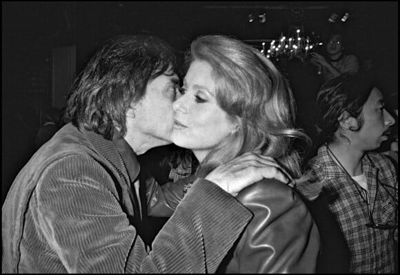 Archives - David Bailey et son ex-femme Catherine Deneuve lors du défilé Yves Saint Laurent, en 1983.