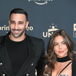 Adil Rami et sa compagne Léna Guillou - Photocall de la cérémonie des Trophées UNFP 2022 au Pavillon Gabriel à Paris le 15 mai 2022. © Coadic Guirec/Bestimage