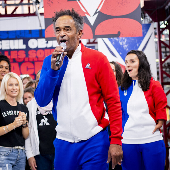 Yannick Noah et Soprano lors du défilé de la collection Olympique de l'équipementier "Le Coq Sportif" à Romilly-sur-Seine, France, le 4 octobre 2021. © Jean-Baptiste Autissier/Panoramic/Bestimage