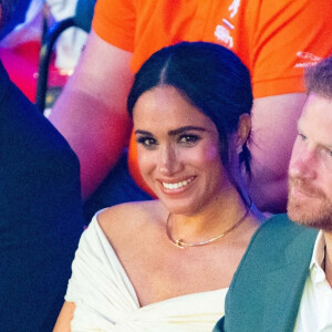 Le prince Harry et Meghan Markle lors de la cérémonie d'ouverture des Invictus Games 2020 à La Haye, le 16 avril 2022. 