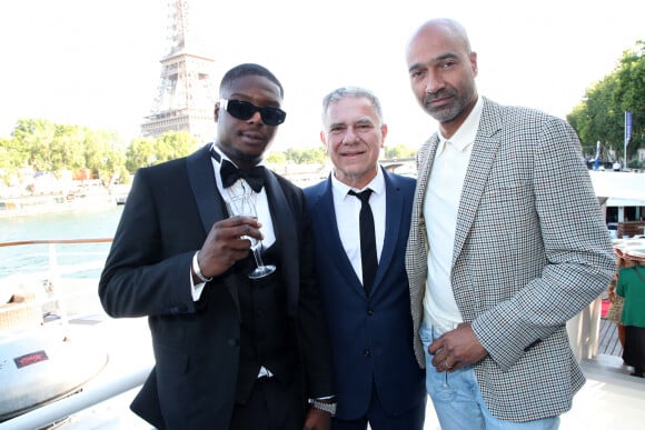 Exclusif - William Ninho, Thierry Chassagne, Wiliam Edorth - Thierry Chassagne reçoit les insignes de Chevalier dans l'Ordre de la Légion d'Honneur des mains de Lévon Sayan sur le bateau "Le Paris" au port Debilly dans le quartier de Chaillot du 16ème arrondissement de Paris, France, le 13 juin 2022. © Bertrand Rindoff/Bestimage