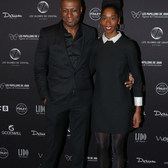 Harry Roselmack et sa femme Chrislaine au photocall de la 11ème cérémonie des Globes de Cristal au Lido à Paris le 30 janvier 2017. © CVS / Bestimage 