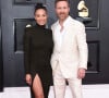 David Guetta et sa compagne Jessica au photocall de la 64ème édition des Grammy Awards au MGM Grand Garden à Las Vegas le 3 avril 2022. 