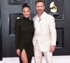 David Guetta et sa compagne Jessica au photocall de la 64ème édition des Grammy Awards au MGM Grand Garden à Las Vegas le 3 avril 2022. 