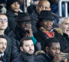 Lilian Thuram et sa compagne Kareen Guiock, Raymond Domenech dans les tribunes lors du 16ème de finale de la Coupe de France 2018 "PSG - Guingamp (4-2)" au Parc des Princes à Paris, le 24 janvier 2018.