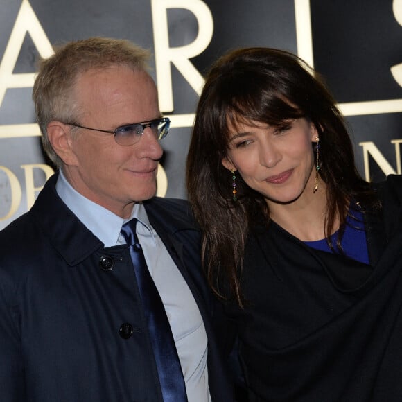 Sophie Marceau et son compagnon Christophe Lambert - Arrivée des people au défilé Giorgio Armani Haute Couture Printemps/Ete 2014 au Palais de Tokyo a Paris, le 21 janvier 2014. 