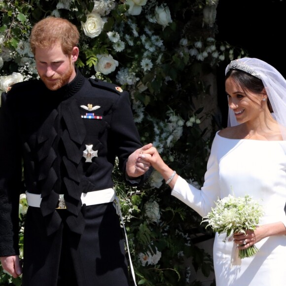 La duchesse Meghan de Sussex (Meghan Markle) dans sa robe Givenchy, dessinée par Clare Waight Keller, lors de son mariage avec le prince Harry le 19 mai 2018 à Windsor.