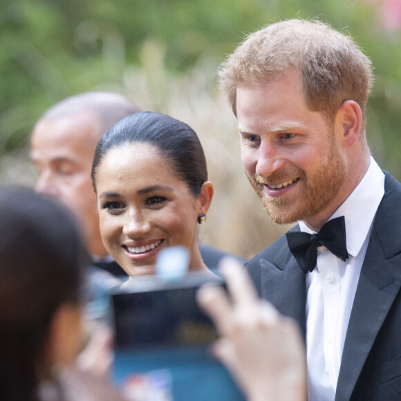 Le prince Harry, duc de Sussex, et Meghan Markle, duchesse de Sussex, à la première du film "Le Roi Lion" au cinéma Odeon Luxe Leicester Square à Londres, le 14 juillet 2019.