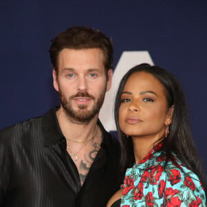 Matt Pokora et sa femme Christina Milian au photocall lors de la première du film "Ambulance" à Los Angeles le 4 avril 2022. 