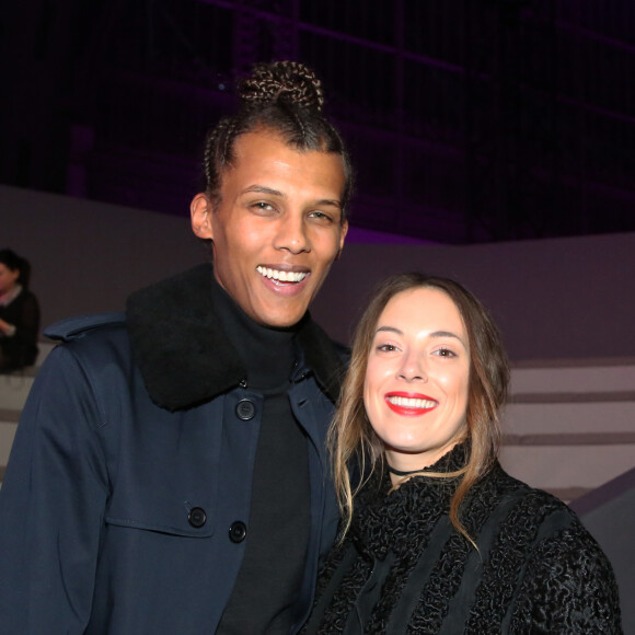 Stromae (nouvelle coupe de cheveux) et sa femme Coralie Barbier au défilé "Victoria's Secret Paris 2016" au Grand Palais à Paris, le 30 novembre 2016. © Denis Guignebourg/Bestimage 