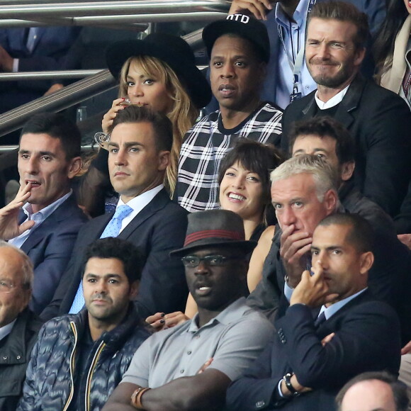 Beyonce, Jay-Z, David Beckham, Fabio Cannavaro, Patrick Bruel et sa compagne Caroline, Didier Deschamps, Jamel Debbouze, Lilian Thuram - People assistent au match PSG-Barcelone de la Ligue des Champions 2014 au parc des princes à Paris le 30 septembre 2014. Le PSG à remporté le match sur le score de 3-2.