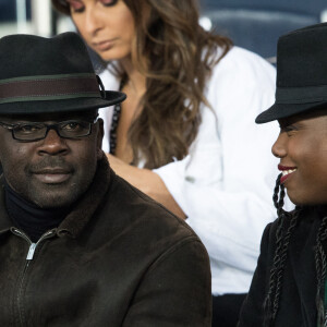 Lilian Thuram et sa compagne Kareen Guiock. Lilian Thuram regarde son fils Marcus (évoluant au poste d'attaquant à l'En Avant de Guingamp) - Célébrités dans les tribunes du parc des princes lors du match de football de ligue 1, le Paris Saint-Germain (PSG) contre En Avant de Guingamp (EAG) à Paris, France, le 29 avril 2018. Paris et Guingamp ont fait match nul 2 - 2. © Cyril Moreau/Bestimage