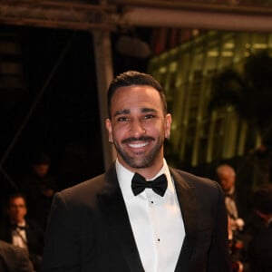 Adil Rami - Montée des marches du film "Novembre" lors du 75ème Festival International du Film de Cannes, le 22 mai 2022. © Rachid Bellak / Bestimage 