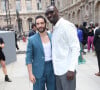 Tahar Rahim et Omar Sy lors du défilé de mode Homme printemps-été 2023 Louis Vuitton dans la cour Carrée du Louvre à Paris, le 23 juin 2022. © Bertrand Rindoff/Bestimage