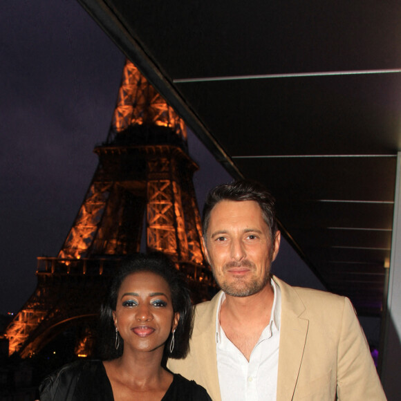 Exclusif - Hapsatou Sy et son mari Vincent Cerruti - Le Grand Dîner du 14 juillet, sur le rooftop de l'hôtel Pullman Tour Eiffel à Paris, France, le 14 juillet 2021. © Philippe Baldini/Bestimage  No Web - Belgique et Suisse