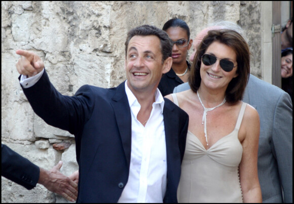 Nicolas Sarkozy et son épouse de l'époque Cécilia lors du mariage de Jean Reno et Zofia en 2006