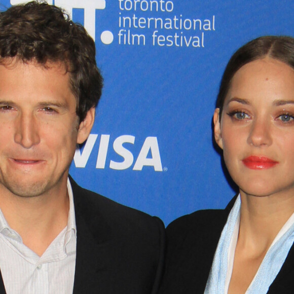 Marion Cotillard (habillee en Dior Haute Couture) et Guillaume Canet - Conference de Presse du film "Bood Ties" lors du Festival International du Film de Toronto, le 10 septembre 2013. 