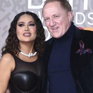 Salma Hayek et son mari Francois-Henri Pinault au photocall de la cérémonie des Brit Awards 2023 à l'O2 Arena à Londres le 11 février 2023.  