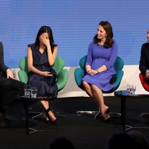 Le prince William, duc de Cambridge, Catherine (Kate) Middleton, duchesse de Cambridge (enceinte), le prince Harry et sa fiancée Meghan Markle assistent au premier forum annuel de la Royal Foundation qui se tient à Aviva le 28 février 2018 à Londres, en Angleterre. Sur le thème "Faire la différence ensemble", l'événement présentera les programmes lancés ou initiés par la Royal Foundation. 