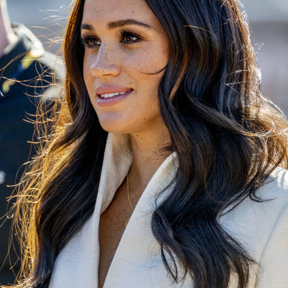 Le prince Harry et Meghan Markle assistent à la finale d'athlétisme, au deuxième jour des Invictus Games 2020 à La Haye, le 17 avril 2022. 