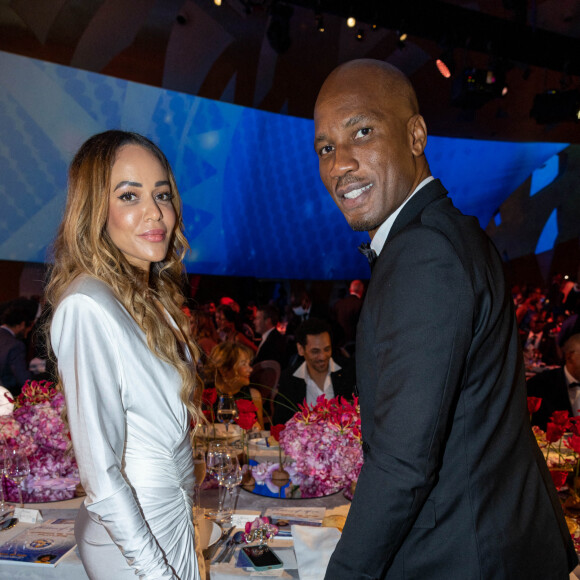 La belle entrepreneuse a partagé plusieurs photos de son ventre déjà bien rond
 
Exclusif - Didier Drogba et et sa compagne Gabrielle Lemaire - L'association "Children of Africa" dont Madame Dominique Ouattara (Première dame de Côte d'Ivoire) est présidente organise le dîner de gala sur le thème Africa is the Future à Abidjan donné au profit de la création d'un foyer d'accueil pour ls femmes victimes de violences et la reconstruction de la Case des Enfants. Diner de gala spécialement conçu par le Chef Trois Étoiles Y.Alleno et la Cheffe Ivoirienne P.Gilbert, spectacle présenté par K.Touré et Y.Zogbo, voyage dans le futur avec les ballets de Georges Momboye et nles grandes stars africaines du 21 ème Siècle. Vente aux enchères animée par Maître Julien-Vincent Brunie de chez Christie's et Maître Jean-Noël Sampah. Hotel Sofitel Ivoire à Abidjan le 11 mars 2022 © Olivier Borde / Bestimage