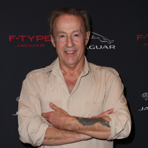 Gerard Klein pose pour le lancement de la nouvelle jaguar F-Type à Paris a L'atrium Banque. France le 31 Janvier 2013