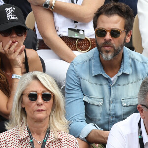 Tous les deux sont nés de son amour pour sa femme Nadège. 
Christophe Maé et sa compagne Nadége Sarron - Célébrités dans les tribunes des internationaux de France de tennis de Roland Garros à Paris, France, le 9 juin 2019. © Jacovides-Moreau/Bestimage 