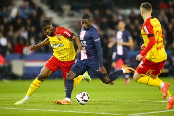 Nuno Mendes (PSG) vs Kevin Danso (RC Lens) - Match de championnat de Ligue 1 Uber Eats opposant le Paris Saint-Germain (PSG) au RC Lens (3-1) au Parc des Princes à Paris le 15 avril 2023.  Ligue 1 Uber Eats championship match between Paris Saint-Germain (PSG) and RC Lens (3-1) at the Parc des Princes in Paris on April 15, 2023. 