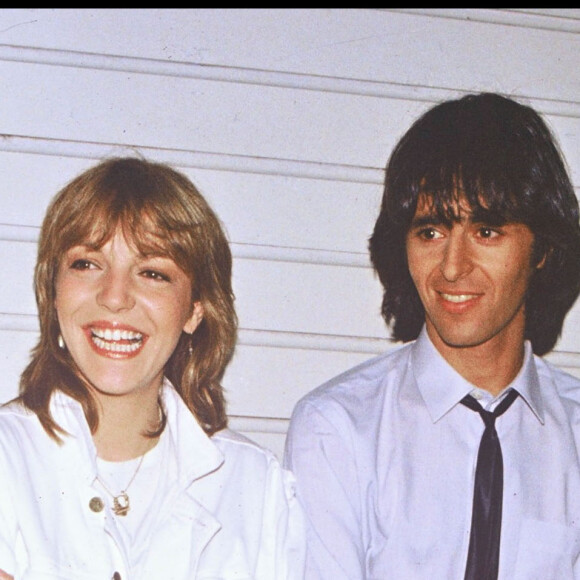 Jean-Jacques Goldman et la chanteuse Buzy, en 1983. © Agence / Bestimage