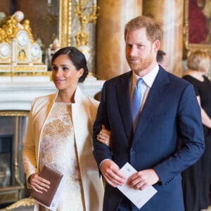 Le prince Harry, duc de Sussex, et Meghan Markle (enceinte), duchesse de Sussex - La famille royale d'Angleterre lors de la réception pour les 50 ans de l'investiture du prince de Galles au palais Buckingham à Londres. Le 5 mars 2019 