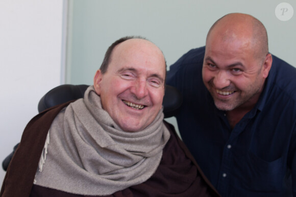 Intouchables - Philippe Pozzo di Borgo (dont la vie a inspiré le film "Intouchables) et son auxiliaire de vie Abdel Yasmin Sellou pendant 10 ans et aujourd'hui chef d'entreprise. Auteur du livre 'Tu as changé ma vie...' au centre de congrès Diagora-Labège à Toulouse, le 12 octobre 2014, à l'occasion d'un colloque organisé par l'association "Une place pour chacun".