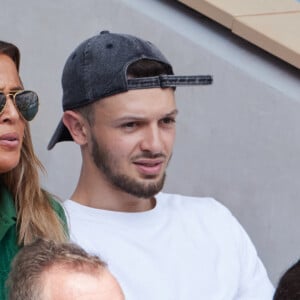 La chanteuse Nâdiya et son fils Yanis en tribunes lors des Internationaux de France de tennis de Roland Garros 2023, à Paris, France, le 9 juin 2023. © Jacovides-Moreau/Bestimage 