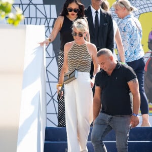 Exclusif - Laeticia Hallyday, sa fille Joy et son chauffeur Carl dans l'Espace VIP lors de la 9ème édition du "Longines Paris Eiffel Jumping" au Champ de Mars à Paris, France, le 25 juin 2023. © Perusseau-Veeren/Bestimage 