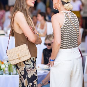 Exclusif - Mathilde Pinault et Laeticia Hallyday dans l'Espace VIP lors de la 9ème édition du "Longines Paris Eiffel Jumping" au Champ de Mars à Paris, France, le 25 juin 2023. © Perusseau-Veeren/Bestimage 