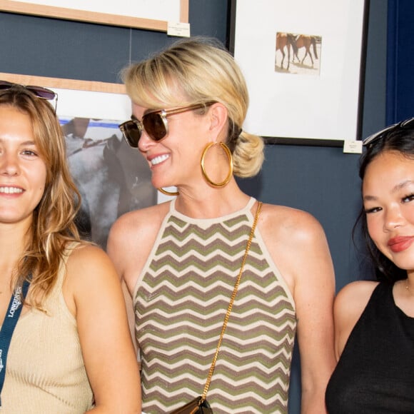 Exclusif - Sarah Poniatowski, sa fille Yasmine Lavoine, Laeticia Hallyday et sa fille Joy dans l'Espace VIP lors de la 9ème édition du "Longines Paris Eiffel Jumping" au Champ de Mars à Paris, France, le 25 juin 2023. © Perusseau-Veeren/Bestimage 