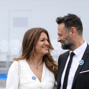 Marlène Schiappa Secrétaire d'Etat auprès de la Première ministre, chargée de l'Economie sociale et solidaire et de la Vie associative et sonn compagnon lors de la cérémonie du 143ème défilé militaire du 14 juillet, jour de la Fête Nationale, sur les Champs-Elysées et la place de la Concorde, à Paris, France, le 14 juillet 2023. © Stéphane Lemouton/Bestimage 