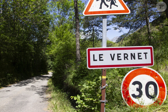 Sign indicating the entrance to the village of Vernet, about fifty mobile gendarmes from Gap sift through \"1.8 km of road\" and \"a strip of about 10 meters\", France on July 13, 2023. Disappearance at Vernet in the Alpes de Haute-Provence of little Emile aged two and a half. Photo by Thibaut Durand/ABACAPRESS.COM 