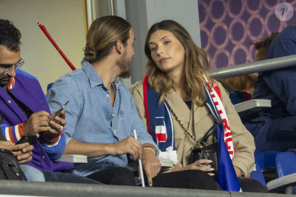 Camille Cerf (Miss France 2015) et son compagnon Théo Fleury - People dans les tribunes lors du match de la 5ème et avant-dernière journée de Ligue des nations entre la France et l'Autriche (2-0) au Stade de France à Saint-Denis le 22 septembre 2022.