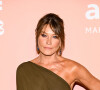 Chaque année, l'amFAR, pour American Foundation for AIDS Research, organise un gala afin de réunir de l'argent pour la recherche contre le sida. 
Carla Bruni au photocall de la soirée "amfAR" lors du 80ème Festival International du Film de Venise (Mostra). 