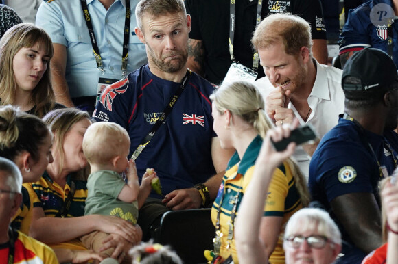 Le prince Harry, duc de Sussex, et sa femme Meghan Markle, duchesse de Sussex, assistent aux finales de natation à la Merkur Spiel-Arena lors des Jeux Invictus à Düsseldorf, en Allemagne, le mercredi 13 septembre 2023. 