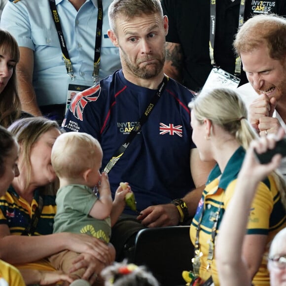 Le prince Harry, duc de Sussex, et sa femme Meghan Markle, duchesse de Sussex, assistent aux finales de natation à la Merkur Spiel-Arena lors des Jeux Invictus à Düsseldorf, en Allemagne, le mercredi 13 septembre 2023. 