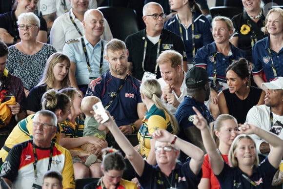 Le prince Harry, duc de Sussex, et sa femme Meghan Markle, duchesse de Sussex, assistent aux finales de natation à la Merkur Spiel-Arena lors des Jeux Invictus à Düsseldorf, en Allemagne, le mercredi 13 septembre 2023. 