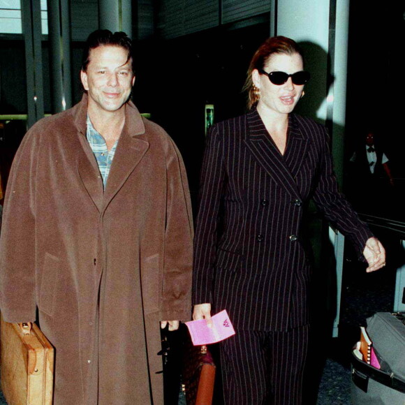 Il aurait assuré qu'il allait se donner la mort par hara-kiri si elle refusait sa demande en mariage.
Mickey Rourke et Carre Otis à Londres.